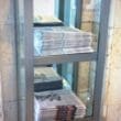 a shelf with newspapers on it