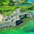 an aerial view of a castle on a rocky island