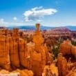 a rock formation in the desert with Bryce Canyon National Park in the background