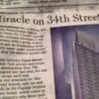 a newspaper with a building in the background