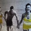 a group of people holding hands in the water