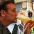 a man drinking from a glass