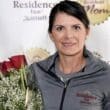 a woman holding a bouquet of roses