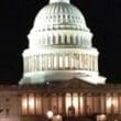 a white building with a dome at night