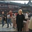 a woman standing on a bridge