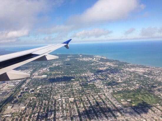 an airplane wing and land and water