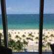 a view of a beach from a window