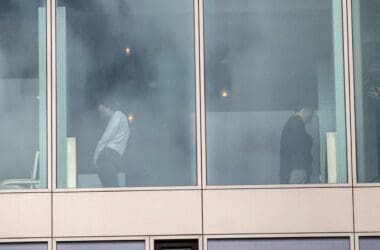 a group of people standing in a window