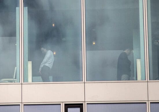 a group of people standing in a window