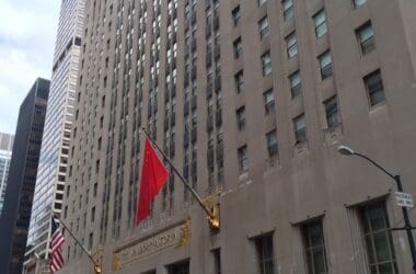 a building with flags on the side