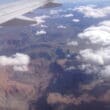 a plane wing over a valley