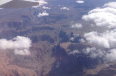 a plane wing over a valley