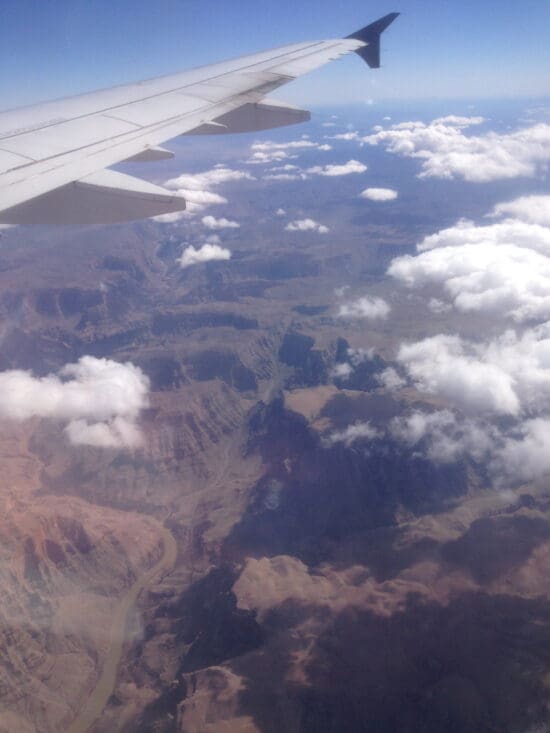 a plane wing over a valley