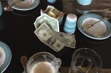 a table with plates and money on it