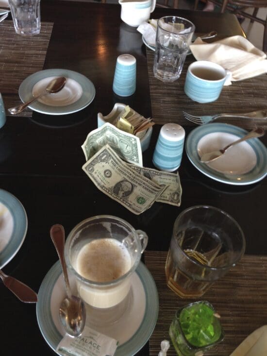 a table with plates and money on it