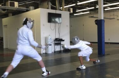 two people in fencing gear