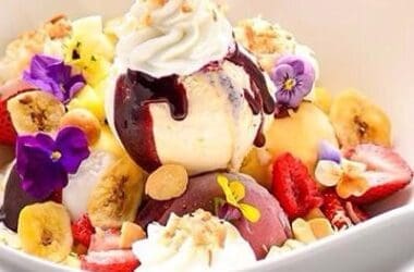 a bowl of fruit and ice cream