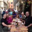 a group of people sitting at a table