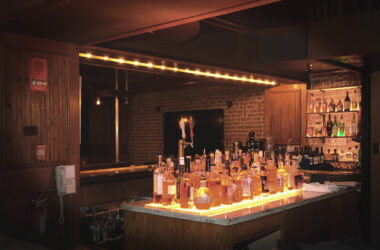 a bar with many bottles of alcohol