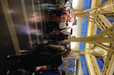 people standing in a line at an airport