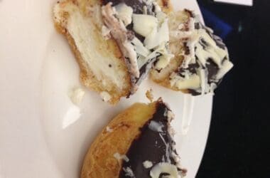 a plate of pastries with chocolate and white chocolate