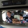 a group of men in a car taking a selfie