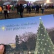 a person holding a postcard with a christmas tree and people in the background