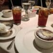 a table with plates of food and drinks