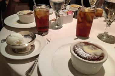 a table with plates of food and drinks