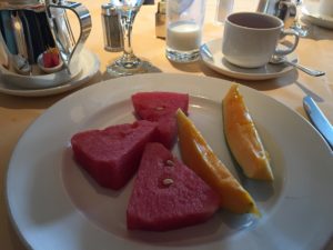 a plate of watermelon and melon slices