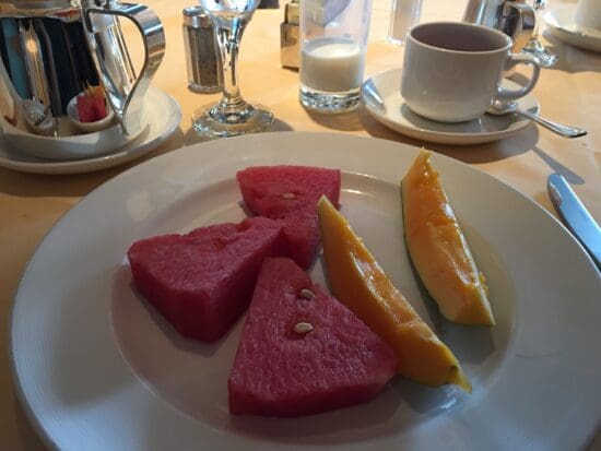 a plate of watermelon and melon slices