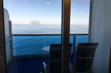 a view of the ocean from a balcony of a cruise ship