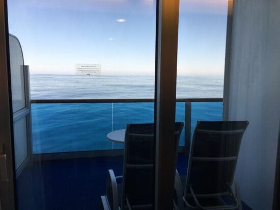 a view of the ocean from a balcony of a cruise ship