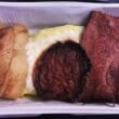 a tray of food with meat and potatoes