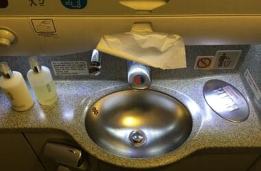 a sink with a faucet and a toilet paper on it