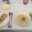 a plate of soup and bread on a table