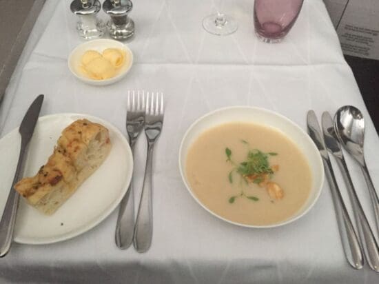 a plate of soup and bread on a table