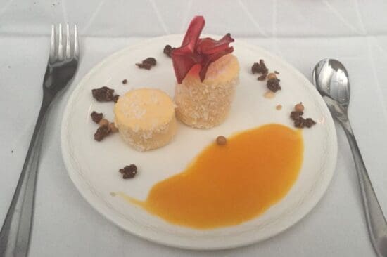 a plate of dessert with a fork and spoon