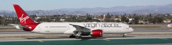 a white airplane on a runway