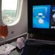 a glass of wine on a table in an airplane