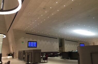 a room with a large ceiling and a television screen