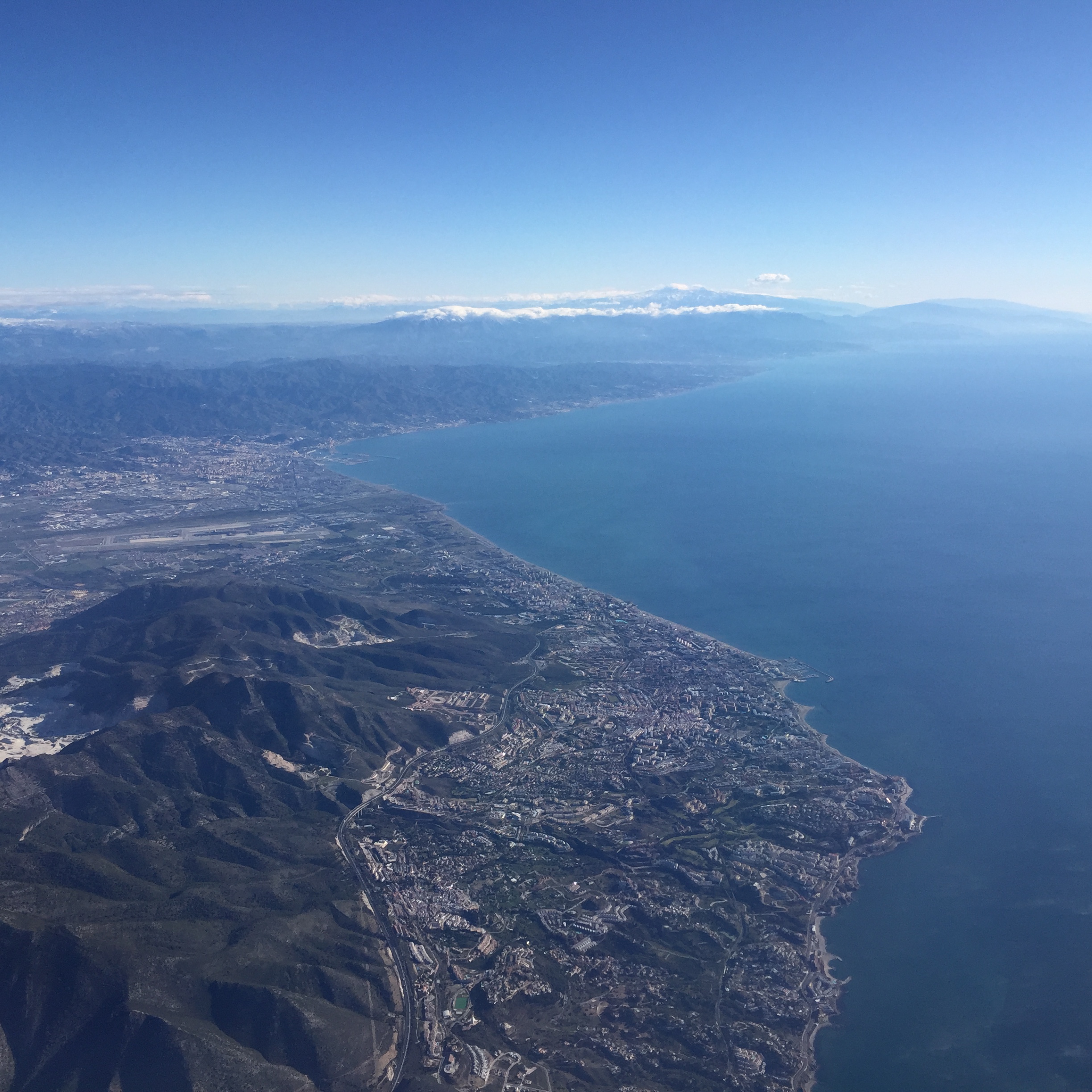 aerial view of a body of water and mountains