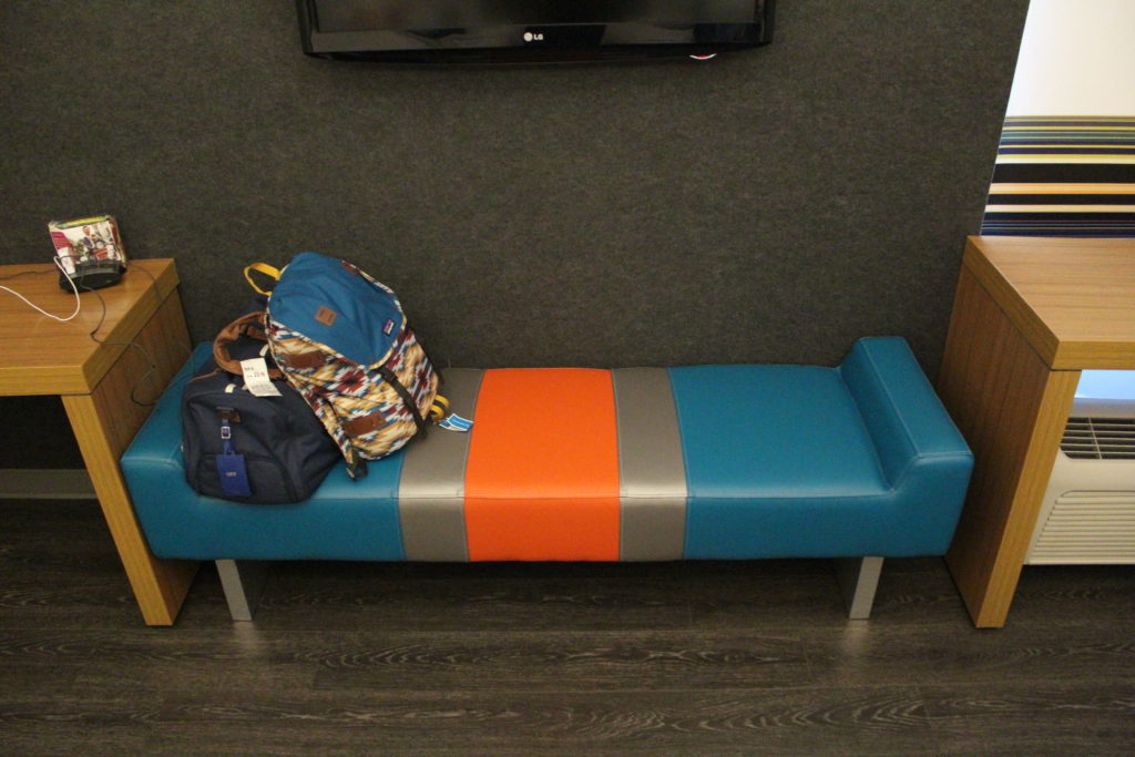 A multi-colored leather ottoman at the Aloft Las Colinas hotel