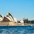 Sydney Opera House with pointed roof and a body of water