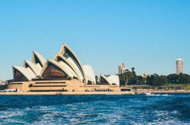 Sydney Opera House with pointed roof and a body of water