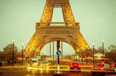 a street with cars and a tower