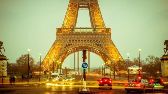 a street with cars and a tower