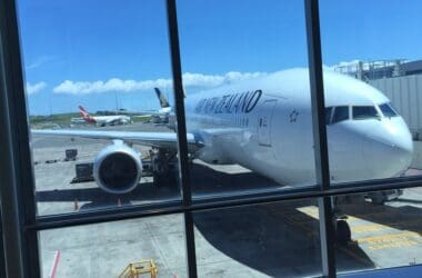 a large white airplane parked at an airport