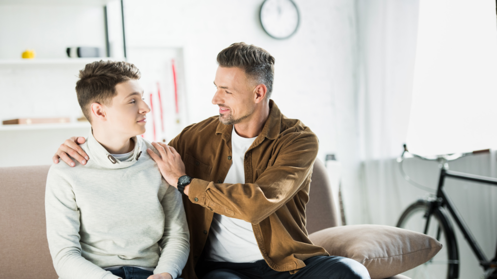 A father and teenaged son have a conversation.