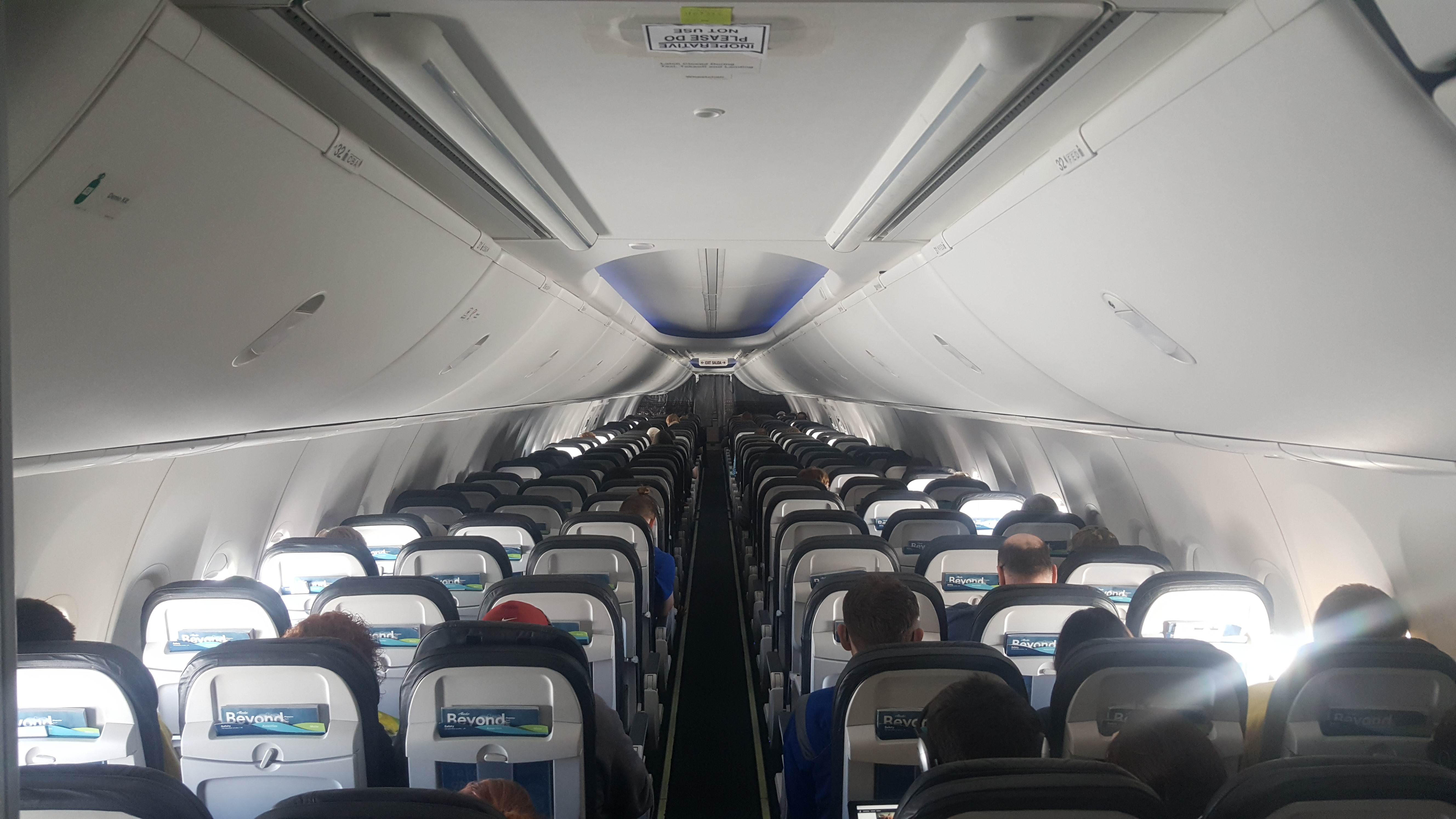 a plane with people sitting in the seats